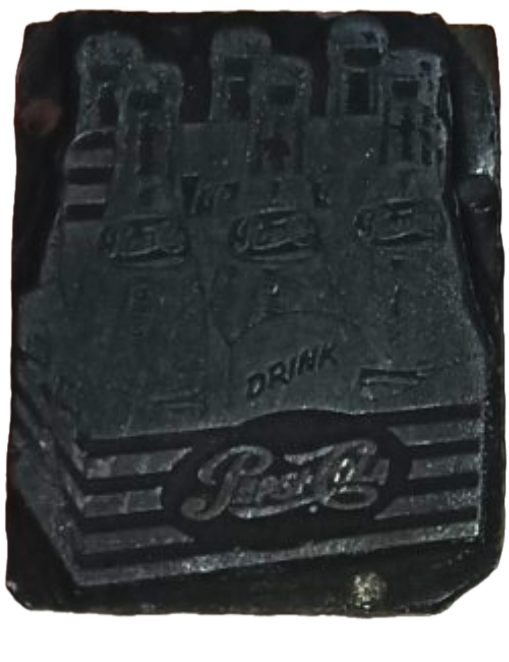 photo of letterpress block described as 'Pepsi bottles' 
