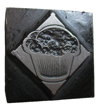 photo of letterpress block described as 'Muffin' 