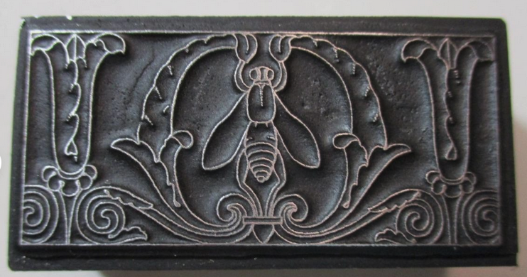 photo of letterpress block described as 'Bee amid flowers' 